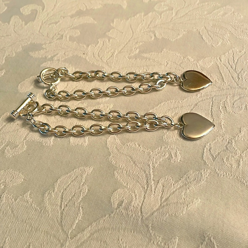 Two identical silver plated chain bracelets
